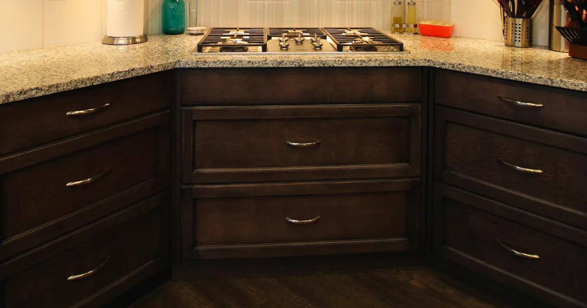 Close-up of a high-function kitchen corner featuring dark espresso-stained shaker cabinetry